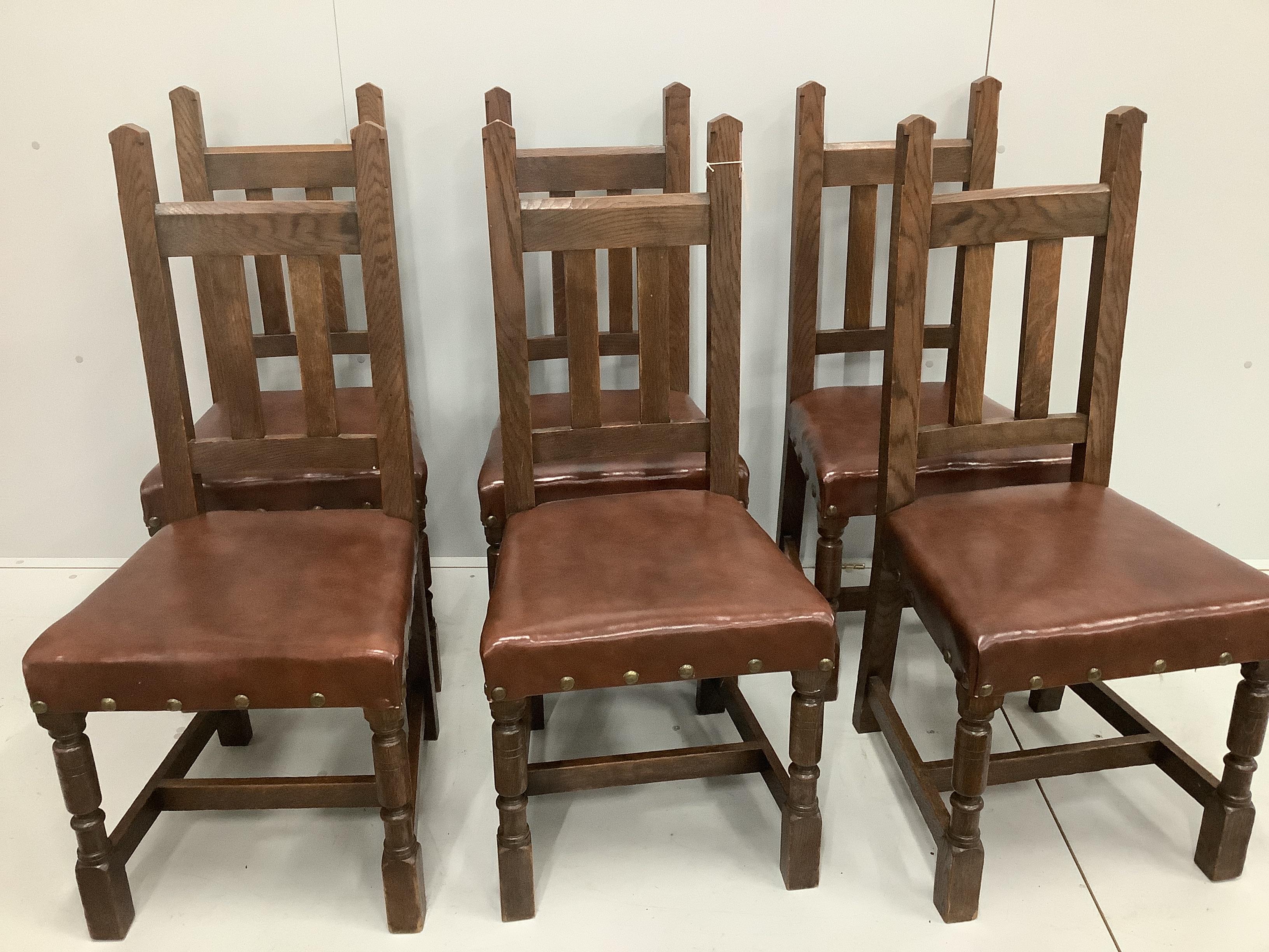A set of six early 20th century oak dining chairs with leatherette seats, width 46cm, height 103cm